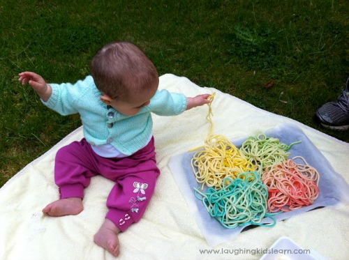 Baby-playing-with-spaghetti